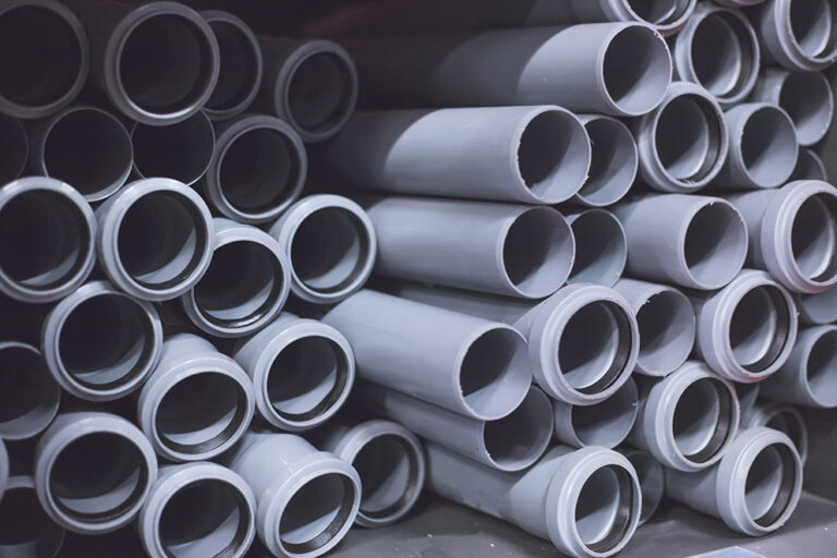 Packaged plastic water pipes at warehouse